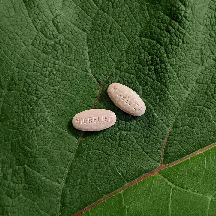 Two MigreLief Original Formula caplets.