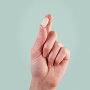 MigreLief capsule being held up.