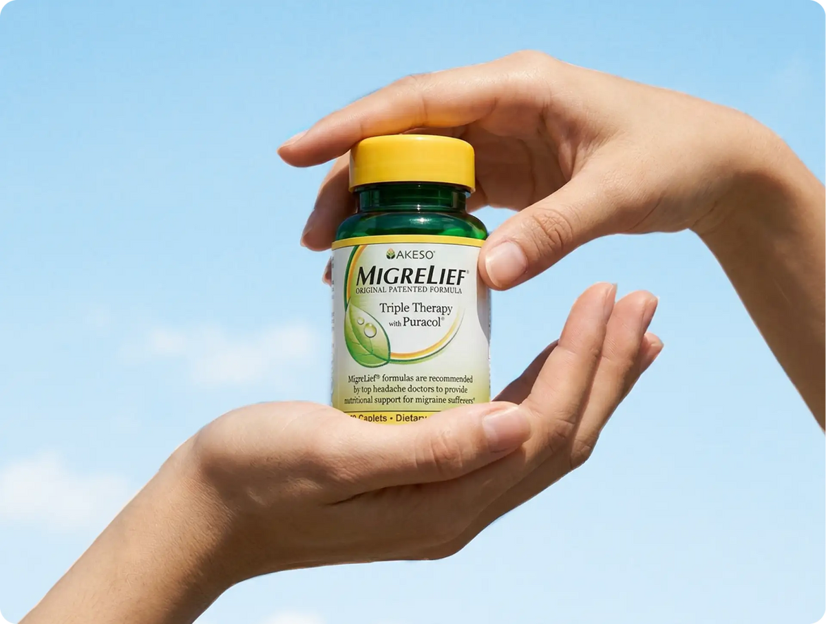 MigreLief Triple Therapy bottle held in hand